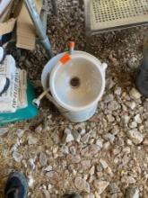 5 Gallon bucket with various PVC items, single bulb light