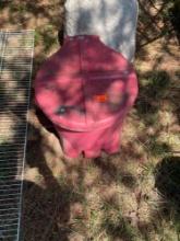 Red trash can with lid and foot open