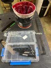 Wheel bearing grease and small container with drill bits