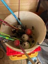 Fishing rods and other misc fishing items in bucket PICK UP IS ON DAY 2 ONLY