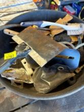 Scraper, scrub brush, fittings in a plastic spill container