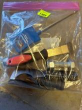Moisture tester, razor blade scraper, bolt and a scraper