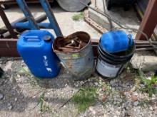 5 gallon bucket, metal bucket with rail road ties, 5 gallon plastic jug, blue small tank