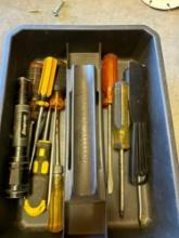 Putty knife, screw drivers and flashlight in carrying caddy