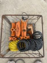 Pipe bender heads and air hoses in metal milk crate
