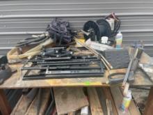 Top shelf, backpack, scissor jack, power washer wand, and other various items