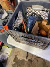 Black milk crate with Pipe fittings, gas regulator, electrical tape, and other various items