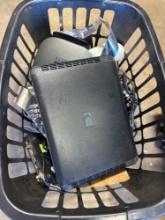 Clothes basket with Direct TV items, remotes, and other items