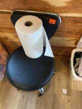 Rolling chair and roll of paper towels