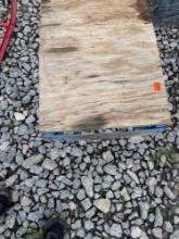 Metal cradle with piece of wood