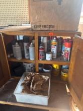 Cabinet with paints and varnishes and bucket of nails