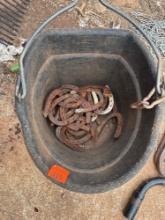 Feed bucket with horse shoes