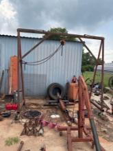 A Frame with Harrington 1 Ton chain hoist 10 ft wide 9 ft tall on casters bring help to load