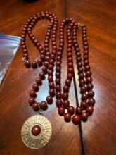 2 beads necklaces one with pendant