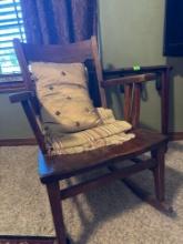 Rocking chair with blanket and pillow