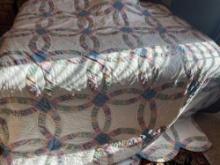 Double wedding ring stitched quilt, some fraying on edges