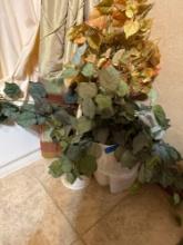 Trash can, toilet brush, greenery