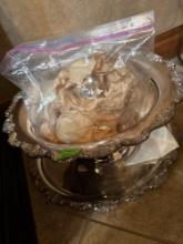 silver punch server with cups and spoon