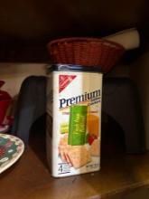 Plates, cracker box, crock pot, stool, vinegar and easter egg decorating kit