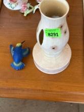 Candle and humming bird