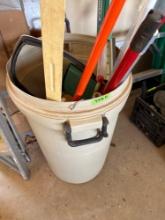 Bucket of cleaning tools, yard stick and basketball