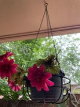 Hanging pot with artificial flowers, may need to bring step stool to get down