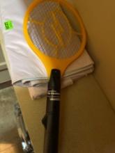 Electric fly swatter and two tablecloths