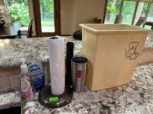 soap, paper towel holder, cups , flashlight and trash can