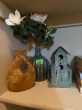 greenery and bird house