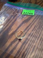 Yellowstone ring with red stone possibly a garnet and white stones size 8