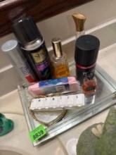 perfume, hairspray, medicine, organizer, and shower cap