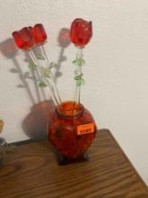 Glass roses in glass heart vase