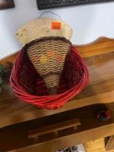 2 wicker baskets and wooden wall decor