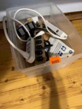 3 surge protectors, wall plug, light bulbs in small plastic container