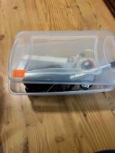Container with massager with heat, ray ban prescription glasses, curling iron and other items