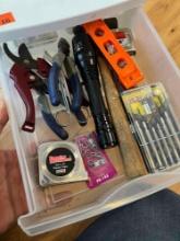 Items in drawer small screw driver stet, level, tape measure, hammer, flash light, wire cutters and