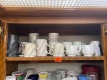 Items on top shelf - coffee mugs, milk glass coffee mugs and other items