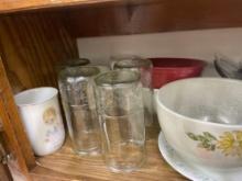 Items on shelf - dinner bowls, jelly jar glasses, coffee mugs