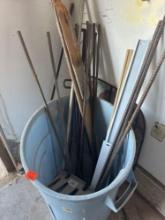 Trash can with rebar, wood pieces and other items