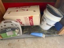 Hose hanger, tarps, 5 gallon bucket and other items on shelf
