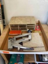 Items in box stapler, organizer and other items