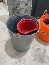 Rope, metal trash can, red bucket