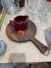 Red creamer and cutting board