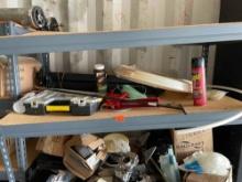 Items on shelf, pex, raid, gopher bait, Stanley organizer, caulking gun, weedeater line