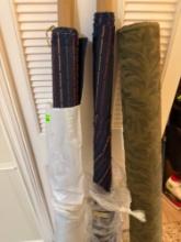 Three rolls of fabric