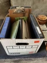 Box of binders and clip boards