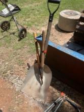 Snow shovel and tree loppers