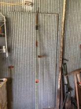 Pole saw blade attached to wood pole