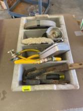 Gray plastic caddy with knife, wrench, castor, spoon and more
