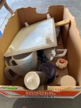 Plastic white tree, metal TV trays, large measuring cups Tupperware, Cheese slicer, utensils, and